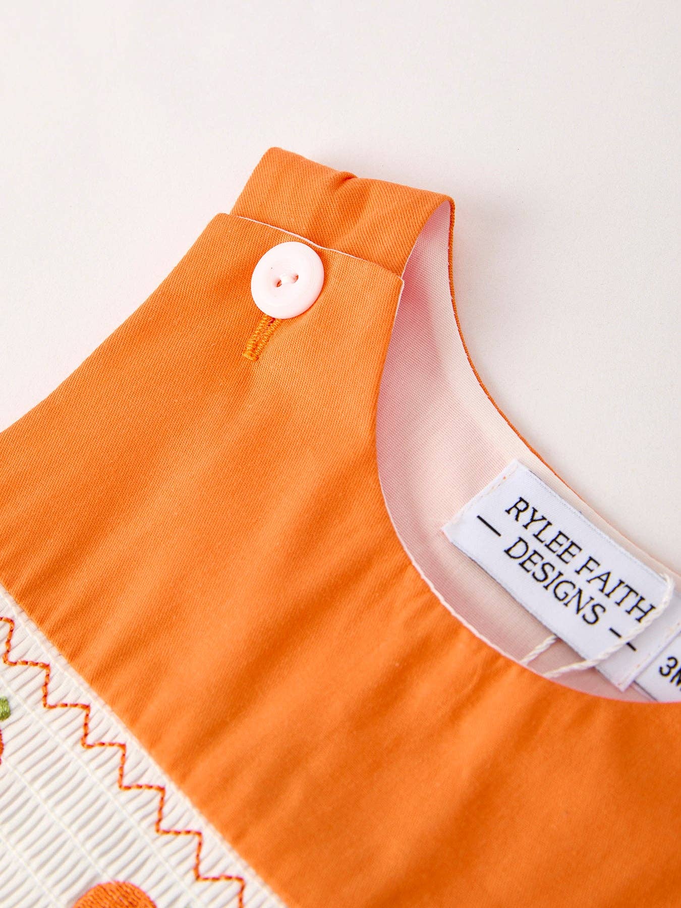 Orange Pumpkin Smocked Romper